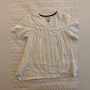 White eyelet top. Short sleeves. Size medium.